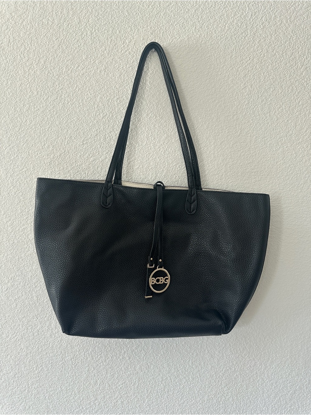 BCBG Reversible Black & Off-White Pebble Grain Tote Bag with Logo Charm